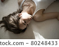 Portrait of a woman lying down 80248433