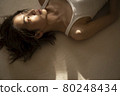 Portrait of a woman lying down 80248434