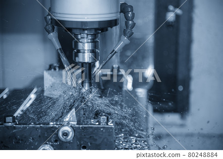 The CNC milling machine cutting the  mold parts with oil coolant method. 80248884