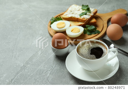 Concept of tasty breakfast with boiled eggs on gray textured table 80248971