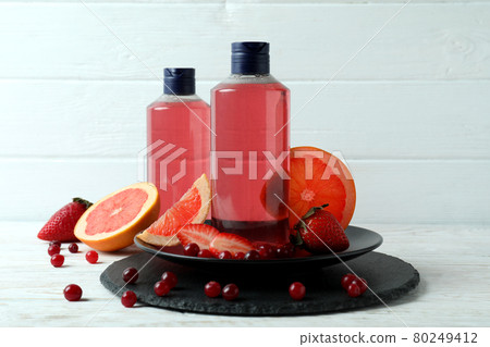Natural shower gel and ingredients against white wooden background 80249412