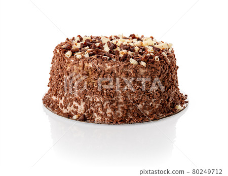 Whole cake with shavings of white and dark chocolate isolated. Water droplets condensed on the cake 80249712