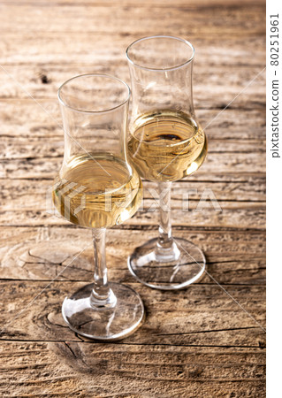 Italian golden grappa drink Italian golden grappa drink 80251961