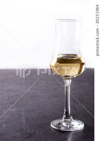 Italian golden grappa drink Italian golden grappa drink 80251964