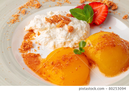 Cottage cheese and canned apricots, healthy breakfast Cottage cheese and canned apricots, healthy breakfast 80253094