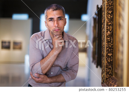 Man is looking at the exposition Man is looking at the exposition 80253255