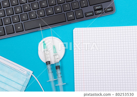 Vaccination or Revaccination Concept - Three Insulin Syringe on Blue Table Vaccination or Revaccination Concept - Three Insulin Syringe on Blue Table 80253530