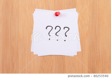 White Sticky Notes with Three Question Marks Pinned to the Wooden Message Board White Sticky Notes with Three Question Marks Pinned to the Wooden Message Board 80253540
