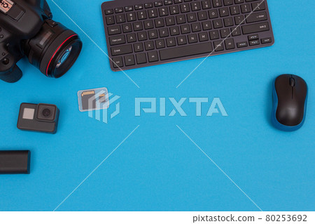 Workplace With Digital Gadgets on Blue Table Workplace With Digital Gadgets on Blue Table 80253692