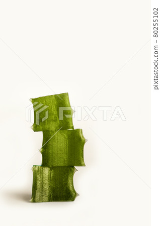 Three slices of aloe vera isolated on white background close-up. Skincare, health care concept. Three slices of aloe vera isolated on white background close-up. Skincare, health care concept. 80255102
