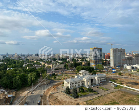 Construction crane next to the house under construction from a height, aerial view 80255388