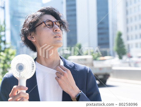 A man who uses a handy fan Shibuya 80258096