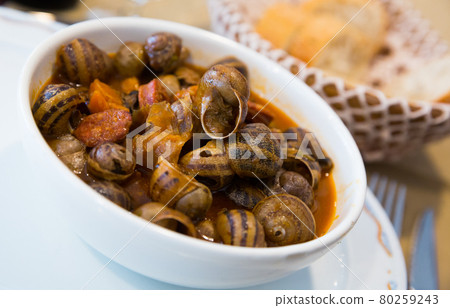 Home style snails stewed with chorizo Home style snails stewed with chorizo 80259243