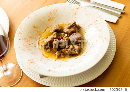 Appetizing lamb stewed with young garlic and paprika 80259246