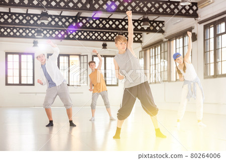 Group teenagers dancing hip-hop indoors Group teenagers dancing hip-hop indoors 80264006