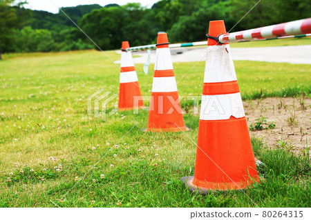 Triangular cones lined up in the park Triangular cones lined up in the park 80264315