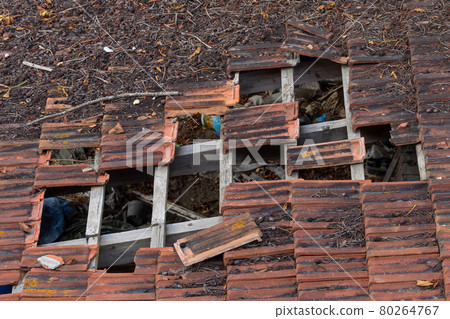 roof made of terracotta tiles and wooden beams seriously damaged 80264767