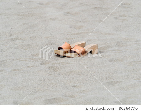 classic female handmade clogs on the beach in summer day classic female handmade clogs on the beach in summer day 80264770