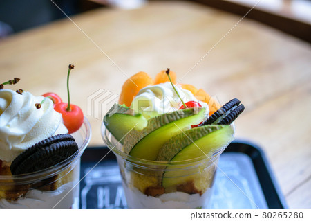 Cherry parfait next to melon parfait 80265280
