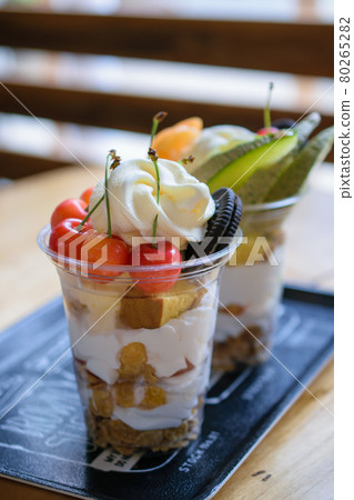 Melon parfait behind the cherry parfait Melon parfait behind the cherry parfait 80265282