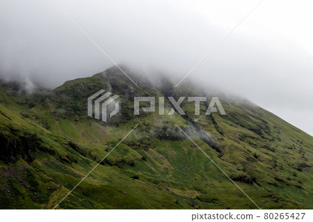 Mist Covered Mountain Top in Glencoe Scotland 80265427