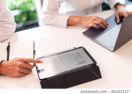 Freelancers wearing protective masks keeping distance as preventive action when working together 80265527