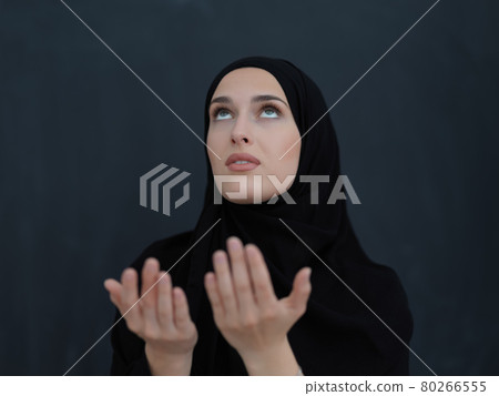 Portrait of young Muslim woman making dua Portrait of young Muslim woman making dua 80266555
