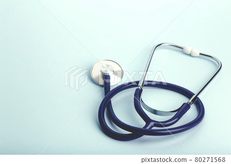 World heart day banner background. Heart as a symbol of health, treatment, charity, donation and cardiology on a blue background with a medical statoscope. 80271568