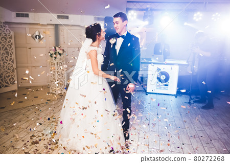First wedding dance of newlywed couple in restaurant First wedding dance of newlywed couple in restaurant 80272268