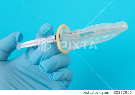 Anti Vaccination Concept - Syringe in a Condom Anti Vaccination Concept - Syringe in a Condom 80272996