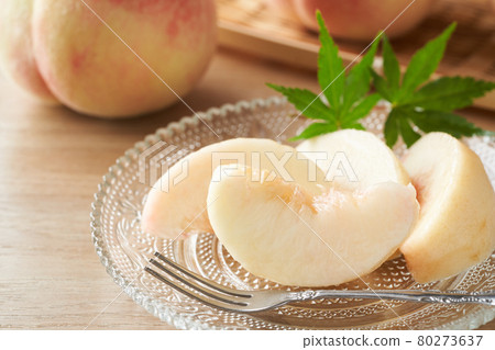 Peach served on a glass plate Peach served on a glass plate 80273637