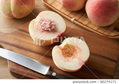 Peach cut in half Peach cut in half 80274171