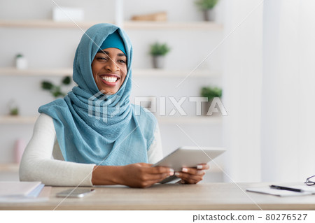 Remote Career. Portrait Of Happy Black Muslim Freelancer Lady With Digital Tablet Remote Career. Portrait Of Happy Black Muslim Freelancer Lady With Digital Tablet 80276527