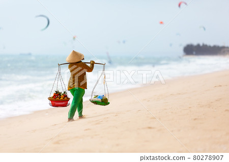 Vietnamese woman selling Fruits at Mui Ne beach. Vietnam. 80278907