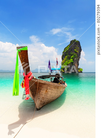 Thai traditional wooden longtail boat and beautiful sand beach at Koh Poda island in Krabi province, Thailand. Thai traditional wooden longtail boat and beautiful sand beach at Koh Poda island in Krabi province, Thailand. 80279394
