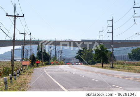 The elevated railway bridge of the double-track project is under construction above the old railway crossing. The elevated railway bridge of the double-track project is under construction above the old railway crossing. 80281045