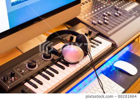 stereo headphone on keyboard synthesizer in home recording studio. music production equipment concept 80281664