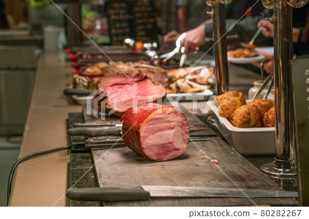 Grilled pork and beef steak in the buffet Grilled pork and beef steak in the buffet 80282267