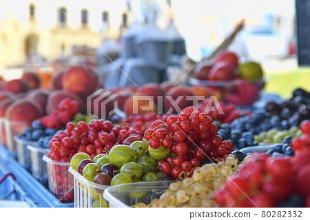 Redcurrants, raspberries, gooseberries, billberries and other fruit and vegetables for sale at local farmers market. Fresh organic produce for sale at local farmers market Redcurrants, raspberries, gooseberries, billberries and other fruit and vegetables for sale at local farmers market. Fresh organic produce for sale at local farmers market 80282332