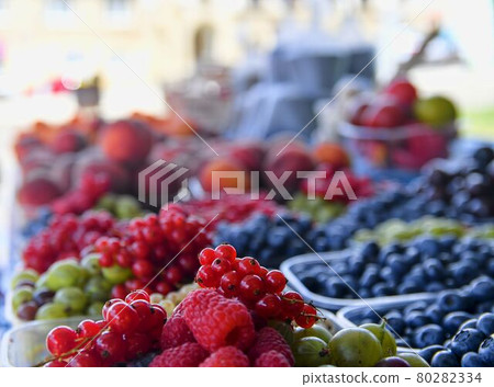 Redcurrants, raspberries, gooseberries, billberries and other fruit and vegetables for sale at local farmers market. Fresh organic produce for sale at local farmers market Redcurrants, raspberries, gooseberries, billberries and other fruit and vegetables for sale at local farmers market. Fresh organic produce for sale at local farmers market 80282334