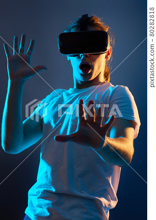 Young man using virtual reality headset. VR gadgets 80282818