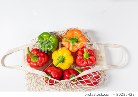 Zero waste concept. Vegetables in eco friendly string bag on white background. 80283422