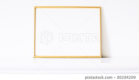Golden frame on white furniture, luxury home decor and design for mockup, poster print and printable art, online shop showcase 80284209