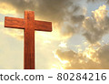 Wood Cross on a mountain top with beautiful sunset sky 80284216