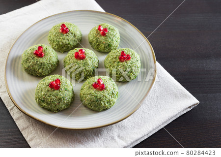 Pkhali with beans on a dark wooden background. Traditional Georgian dish of vegetables, nuts and spices 80284423