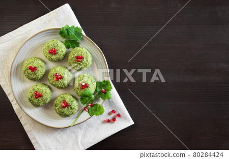 Pkhali with beans on a dark wooden background. Traditional Georgian dish of vegetables, nuts and spices. Copy space. Flat lay, top view 80284424