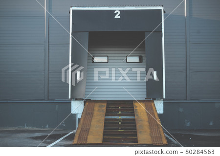 Industrial loading dock and ramp for a large warehouse. gate for loading cargo Industrial loading dock and ramp for a large warehouse. gate for loading cargo 80284563