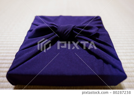 Purple furoshiki wrap on tatami mat 80287238