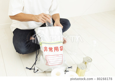 Men preparing disaster prevention supplies Men preparing disaster prevention supplies 80288178