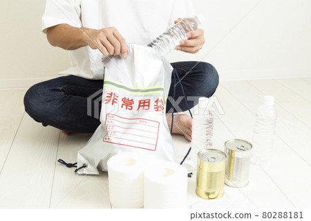 Men preparing disaster prevention supplies Men preparing disaster prevention supplies 80288181